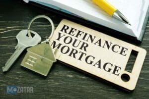 keys-with-a-house-keychain-and-a-wooden-tag-reading-refinance-your-mortgage-on-a-desk